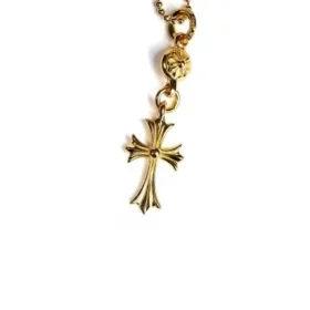 Cruz de oro de 22 quilates con un colgante de bola de oro