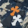 Vaqueros Chrome Hearts con cruz multicolor teñidos al estilo tie-dye